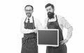 Hiring staff. Men bearded hipster informing you. Men bearded bartender or cook in apron hold blank chalkboard. Workers Royalty Free Stock Photo