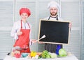Hiring staff. Woman and man chef hold blackboard copy space. Job position. Cooking delicious meal recipe. Cooking menu Royalty Free Stock Photo
