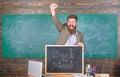 Hiring teachers for new school year. Back to school teachers recruitment. Man bearded holds blackboard inscription back