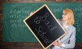 Hiring teachers for new school year. Woman teacher holds blackboard inscription back to school. Back to school teachers