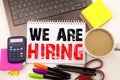 We Are Hiring Writing text in the office with surroundings such as laptop, marker, pen, stationery. Business concept for Recruitme Royalty Free Stock Photo