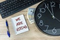 We are hiring written on a notebook with a computer keyboard clock and money Royalty Free Stock Photo