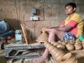 Closeup of Indian Child or kid pot making in a shed