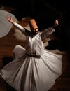 Whirling Dervish Semazen performing Sama ritual on stag Royalty Free Stock Photo