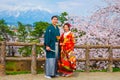 Japanese couple attend a Japanese traditional wedding ceremony at Hirosaki Park Royalty Free Stock Photo