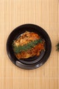 Hiroshima-style okonomiyaki with yakisoba noodles topped with green laver.