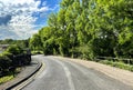 Hirst Lane, with buildings and old trees near, Hirst Wood, Shipley, UK Royalty Free Stock Photo