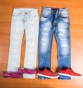 His and Hers Blue Jeans Laid with Shoes Royalty Free Stock Photo