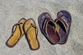 His and hers flip flop sandals on the sandy beach Royalty Free Stock Photo