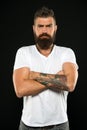His long beard works well. Brutal caucasian guy with beard on black background. Bearded man with stylish mustache and