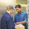 His package has arrived. a young man receiving a package at home.