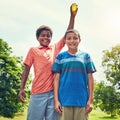 His turn to get wet. adorable young boys playing with water balloons outdoors. Royalty Free Stock Photo