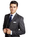 On his way to the top. A handsome young man in a three piece suit standing against a white background. Royalty Free Stock Photo