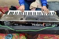 A man`s hands playing the piano or keyboard keys