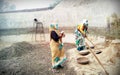 Hisar, Haryana, INDIA - September 2018: indian labours mixing building material