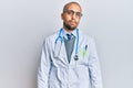 Hispanic adult man wearing doctor uniform and stethoscope looking sleepy and tired, exhausted for fatigue and hangover, lazy eyes Royalty Free Stock Photo