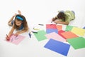 Hispanic boy and girl coloring.