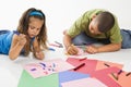 Hispanic boy and girl coloring. Royalty Free Stock Photo