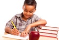 Hispanic Boy Writing with Books, Apple Royalty Free Stock Photo