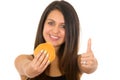 Hispanic brunette model holding up hamburger to Royalty Free Stock Photo