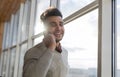 Hispanic Business Man Speak Phone Call Stand In Front Panoramic Window Happy Smiling Businessman Royalty Free Stock Photo