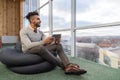 Hispanic Business Man Using Tablet Computer Sit n Front Panoramic Window Happy Smiling Businessman Royalty Free Stock Photo