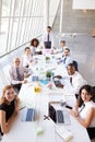 Hispanic Businessman Leading Meeting At Boardroom Table Royalty Free Stock Photo