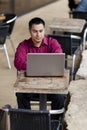 Hispanic Businessman - Telecommuting Internet Cafe Royalty Free Stock Photo