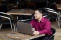 Hispanic Businessman - Telecommuting Internet Cafe Royalty Free Stock Photo