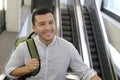 Hispanic businessman using moving staircase Royalty Free Stock Photo