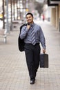 Hispanic Businessman - Walking Briefcase Royalty Free Stock Photo