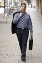 Hispanic Businessman - Walking With Briefcase Royalty Free Stock Photo