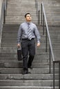 Hispanic Businessman - Walking Down Staircase Royalty Free Stock Photo