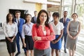 Hispanic businesswoman and her business team, group portrait Royalty Free Stock Photo