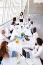 Hispanic Businesswoman Leading Meeting At Boardroom Table Royalty Free Stock Photo