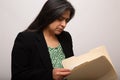 Hispanic Businesswoman Looks Through File