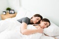 Young beautiful girlfriends asleep in a white comfy bed Royalty Free Stock Photo