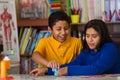 Hispanic Child Completing Puzzle with Mom