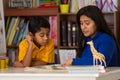 Hispanic Child Learning to Read with Mom Royalty Free Stock Photo