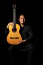 hispanic classical guitarist guitar player on a black background, studio shot portrait Royalty Free Stock Photo