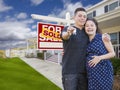 Hispanic Couple with Keys In Front of Home and Sign Royalty Free Stock Photo