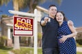 Hispanic Couple, Keys, New Home and Sold Real Estate Sign Royalty Free Stock Photo
