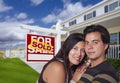 Hispanic Couple, New Home and Sold Real Estate Sign Royalty Free Stock Photo