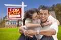 Hispanic Couple, New Home and Sold Real Estate Sign Royalty Free Stock Photo