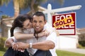 Hispanic Couple, New Home and Sold Real Estate Sign Royalty Free Stock Photo