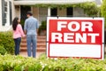 Hispanic couple outside home for rent Royalty Free Stock Photo