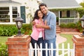 Hispanic couple standing outside home Royalty Free Stock Photo