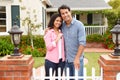 Hispanic couple standing outside new home Royalty Free Stock Photo