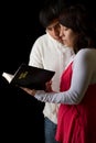 Hispanic Couple Studying the Bible Royalty Free Stock Photo
