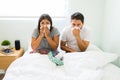 Hispanic couple suffering from a runny nose Royalty Free Stock Photo